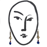 Gold earrings with blue glass and red crystal. 