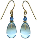 Pair of earrings with blue teardrop-shaped beads and gold accents on a white background