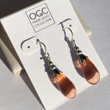 Light peach glass earrings. Glass drops designed by Allen Owen, and made for us in Germany. Silver dipped trim with sterling silver ear wires. All handwork done in the USA.