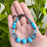 Turquoise glass bracelet.