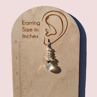 Frosted white glass heart dangle earrings.