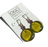 Bright olive green glass earrings with amethyst Austrian crystal top beads. These green glass drops are designed by Allen Owen and made for us in Germany. Ear wires are 14 karat gold-filled, all handwork done in the USA.