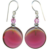 Pair of earrings with pink and dark pink circular beads on a white background