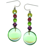 A pair of round peridot glass earrings with green and purple Austrian crystal accents, and silver metal accents.