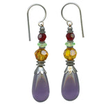 Purple glass earrings. Crystal accents in topaz and red. Silver ear wires. Handwork done in the USA using European glass.