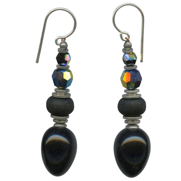 Jet glass drops with Austrian crystal accents and Czech glass. Accent beads are iridescent jet in Austrian crystal. Silver trim with sterling silver ear wires. Handmade in the USA.