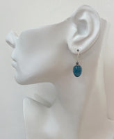 Indigo blue glass drop earrings with sterling silver ear wires. Handmade in the USA.
