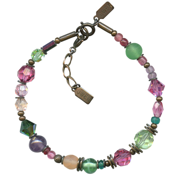 Pastel Czech glass and Austrian crystal bracelet with bronze accents. Pink, peridot and light amethyst glass. Handmade in the USA