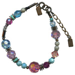 Pink, turquoise, aqua and light amethyst bracelet. Austrian crystal and Czech glass with antiqued bronze. Hand made in the USA.