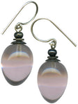 Mauve glass earrings. Glass drops from Germany, designed by Allen Owen. Metal trim is antiqued bronze with sterling silver ear wires. All handwork done in the USA.