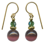 Light byzantium purple glass earrings with tourmaline green Austrian crystal top beads. Trim is gold overlay with 14 karat gold filled ear wires. All handwork done in the USA.