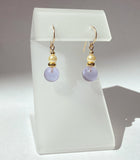 Light amethyst glass drop earrings with glass pearl top beads. 14 karat gold filled ear wires. All handwork done in the USA.