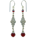 Austrian crystal in siam red with antiqued silver overlay filigree. Ear wires are sterling silver. All handwork done in the USA.