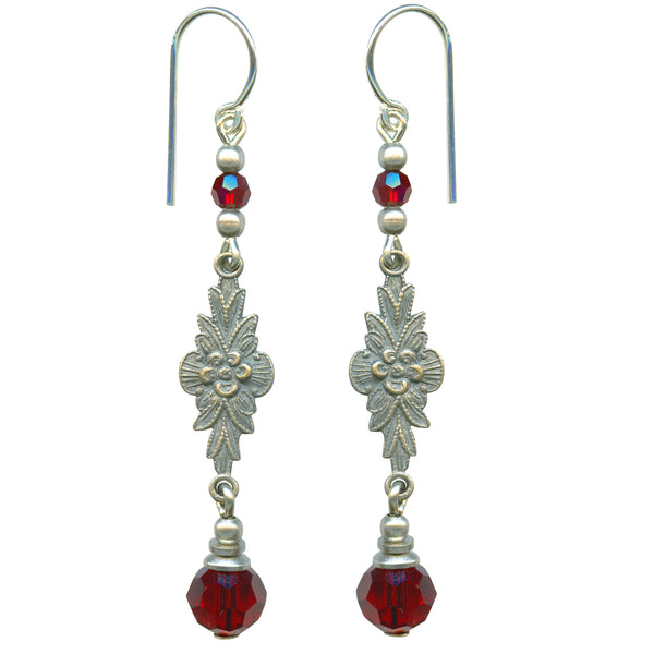 Austrian crystal in siam red with antiqued silver overlay filigree. Ear wires are sterling silver. All handwork done in the USA.
