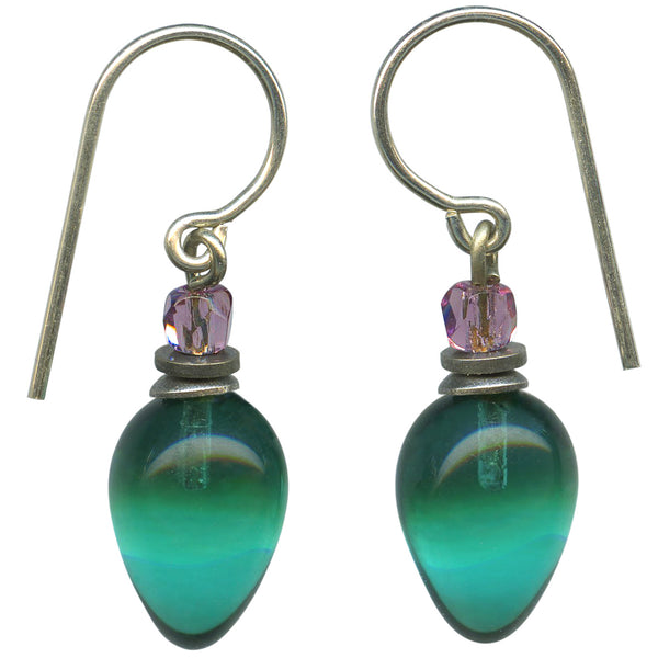 Teal glass drops with light amethyst Czechoslovakian glass top beads. Metal trim is antiqued silver overlay with sterling silver ear wires. All handwork done in the USA.