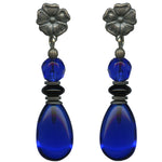 Cobalt earrings. German glass drops with Czechoslovakian top beads in cobalt and jet. Flower posts are antiqued silver overlay. Stainless steel posts. All handwork done in the USA.