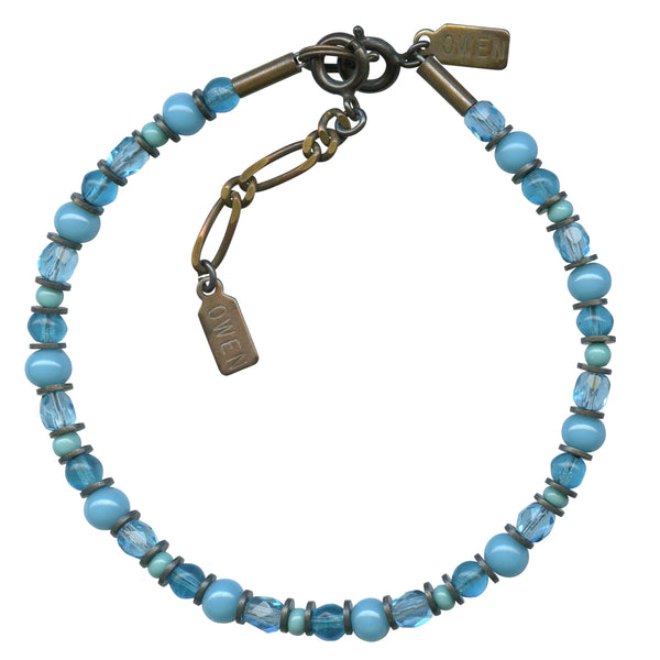 Turquoise bracelet in Czech glass. Trim is antiqued bronze. All handwork done in the USA.