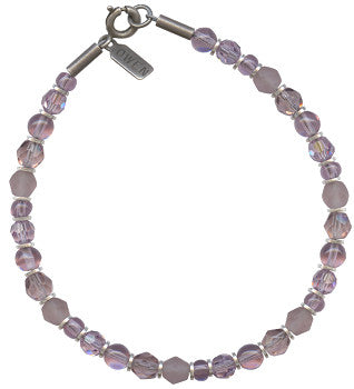 Austrian crystal and Czech glass beaded bracelet in shades of light amethyst. Metal trim is antiqued silver plate, from our own tooling. 7 inch bracelet with a 1 inch extender included. All handwork done in the USA.