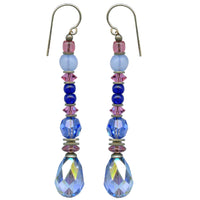 Light sapphire iridescent Austrian crystal drop earrings. Accent beads are Austrian crystal and Czech glass in rose pink and sapphire. Ear wires are sterling silver. All handwork done in the USA.