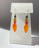 Orange glass drop earrings with Czech glass accents and hematite Austrian crystal top beads. Handmade in the USA.