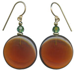 Dark amber glass disc earrings with forest green Austrian crystal top beads. Trim is gold overlay with 14 karat gold filled ear wires. Handmade in the USA.
